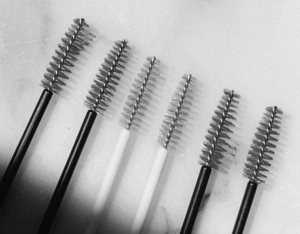 Spoolie applicators for applying dye when tinting eyelsashes.