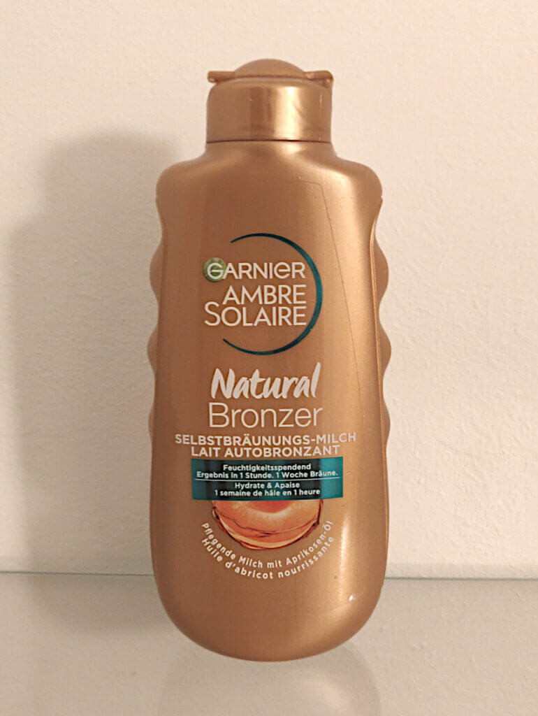 A bottle of Garnier Ambre Solaire. self-tanner for medium skin.