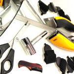 Men’s grooming tools arranged for home haircutting—includes safety razor, clippers, guards, scissors, and comb. A practical setup for self-care or gift ideas for men.