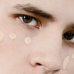 Man wearing unblended tinted moisturizer on his face.