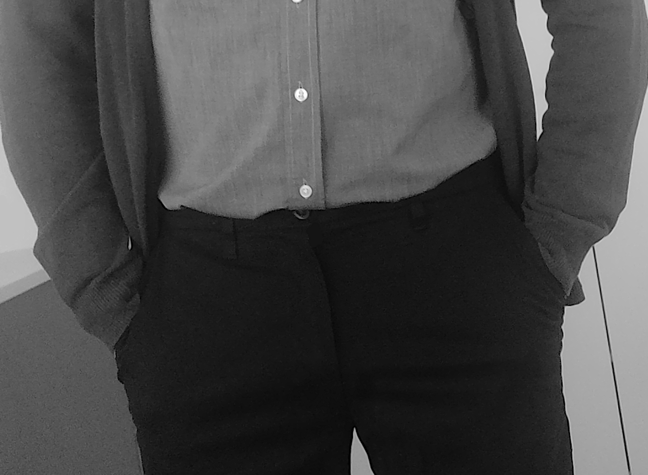 A man with his hands in his pant pockets.