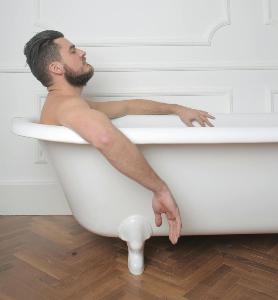 A man taking a relaxing bath.
