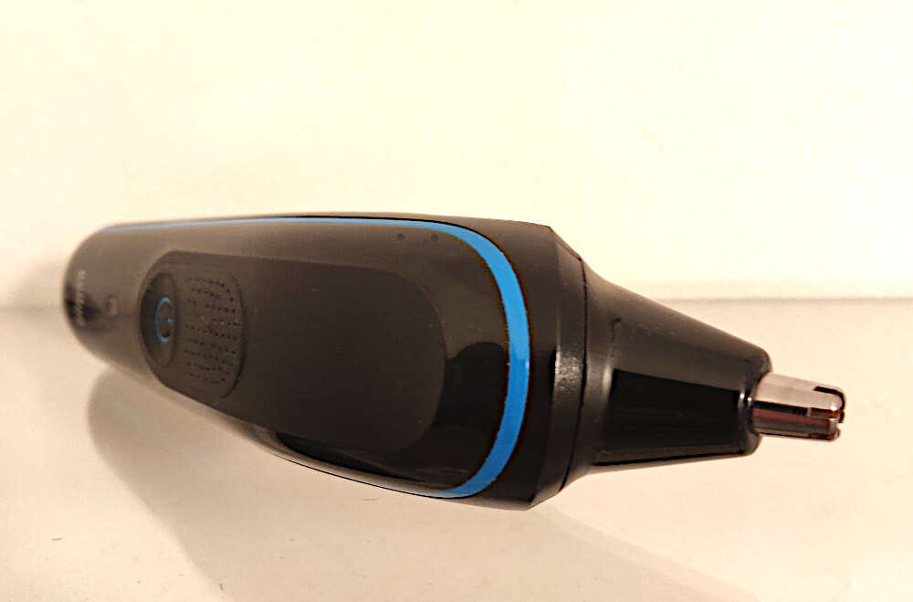 A beard trimmer with a nose hair trimmer attachment.