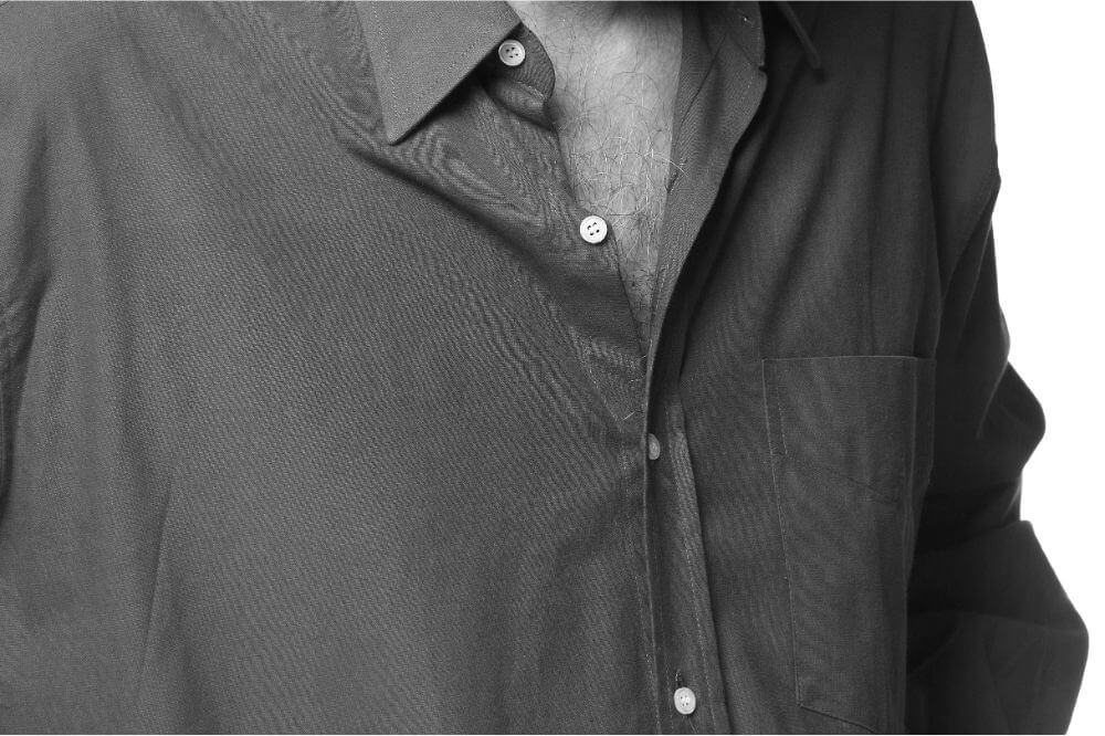 Chest hair shown through an open shirt.