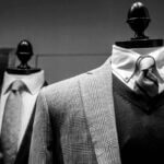 Mannequins displaying classic men's clothing.