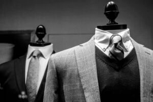 Mannequins displaying classic men's clothing.