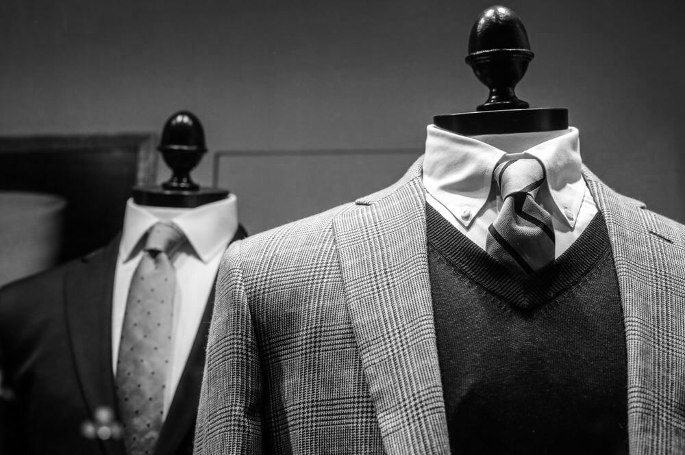 Mannequins displaying classic men's clothing.