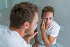 A man applying an exfoliant.