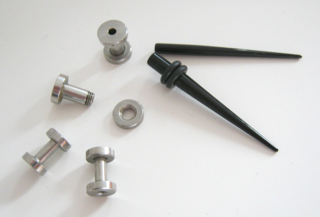 Tapers with O rings for stretching ears and threaded flesh tunnels in two gauges.